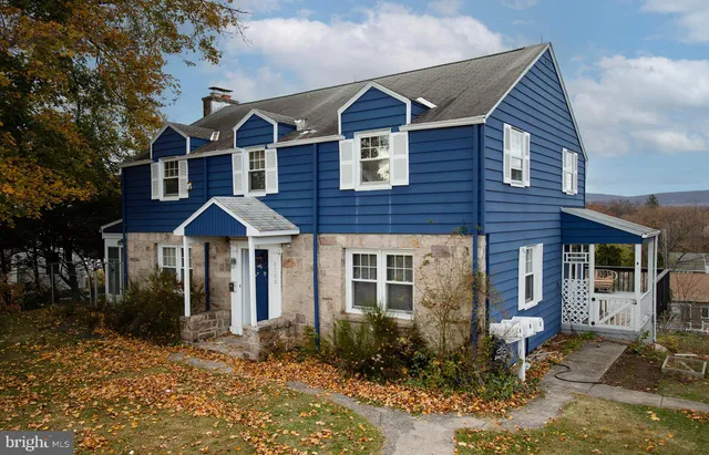 a front view of a house with yard