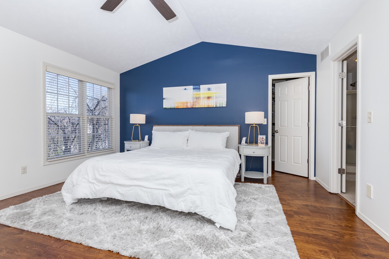 1223 Joy Walk Way Normal, IL 61761 - Photo 19 of 48 a bedroom with a bed and wooden floor