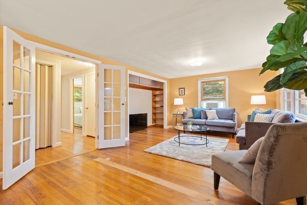 7 Flagg Road Acton, MA 01720 - Photo 22 of 39 a living room with furniture and a fireplace