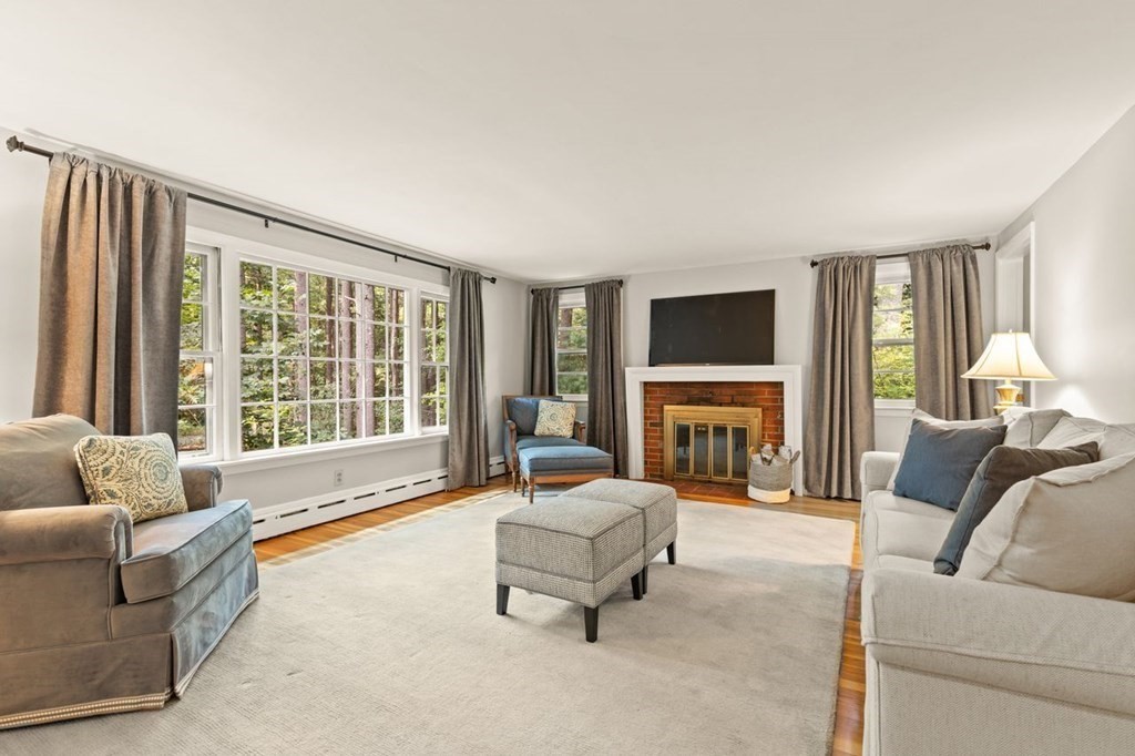 7 Flagg Road Acton, MA 01720 - Photo 9 of 39 a living room with fireplace furniture and a flat screen tv