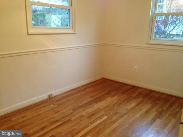 911 Robin Road Silver Spring, MD 20901 - Photo 11 of 15 a view of a small space with wooden floor and a window