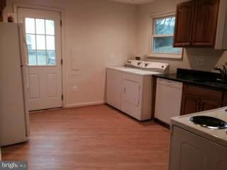 911 Robin Road Silver Spring, MD 20901 - Photo 4 of 15 a utility room with sink dryer and washer