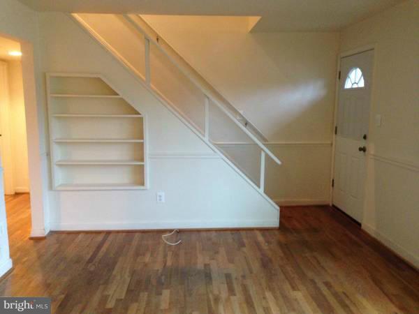 911 Robin Road Silver Spring, MD 20901 - Photo 5 of 15 a view of entryway and hall with wooden floor