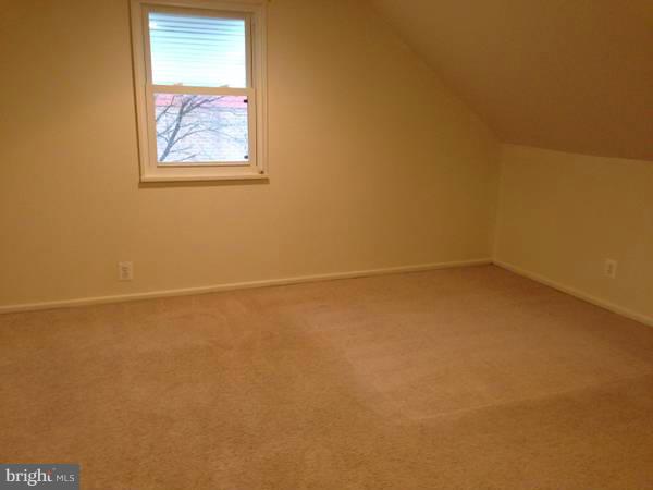 911 Robin Road Silver Spring, MD 20901 - Photo 9 of 15 an empty room with a window
