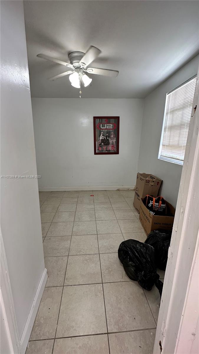 3077 Southwest 5th Street Miami, FL 33135 - Photo 25 of 28 a kitchen with a cabinets and window