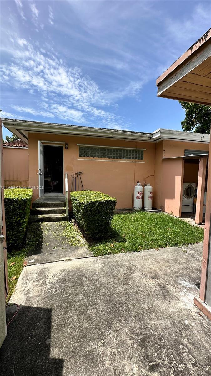 3077 Southwest 5th Street Miami, FL 33135 - Photo 26 of 28 a front view of a house with garden