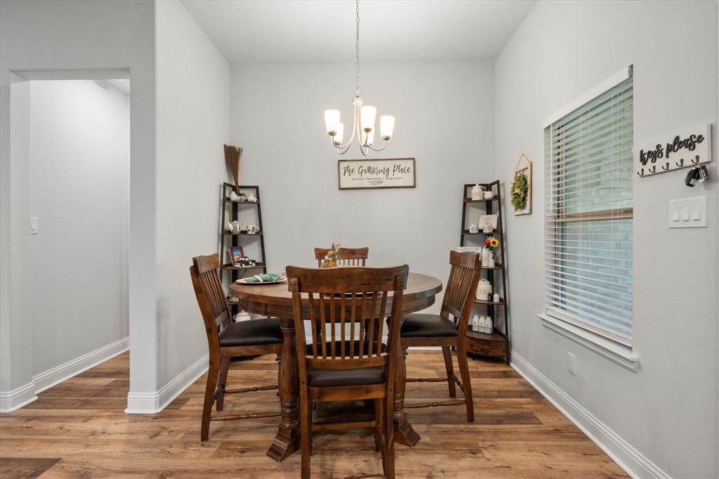 103 Randal Row Corsicana, TX 75110 - Photo 19 of 35 a view of a dining room with furniture and wooden floor