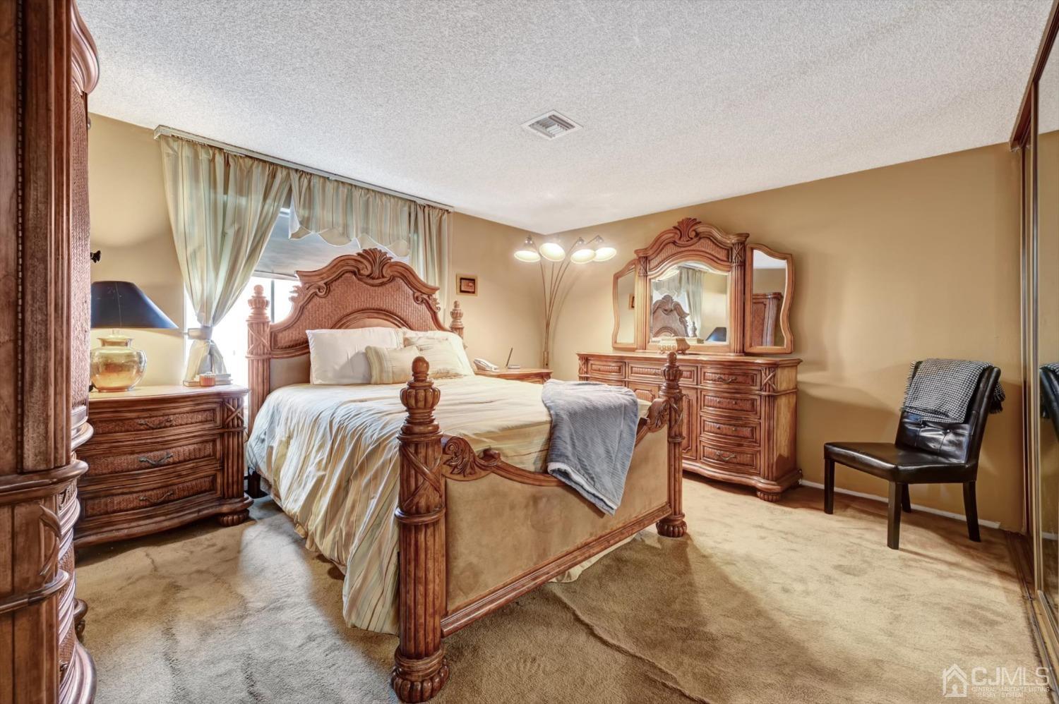 B Haddon Road Monroe Township, NJ 08831 - Photo 14 of 34 a bed room with a bed and a chair