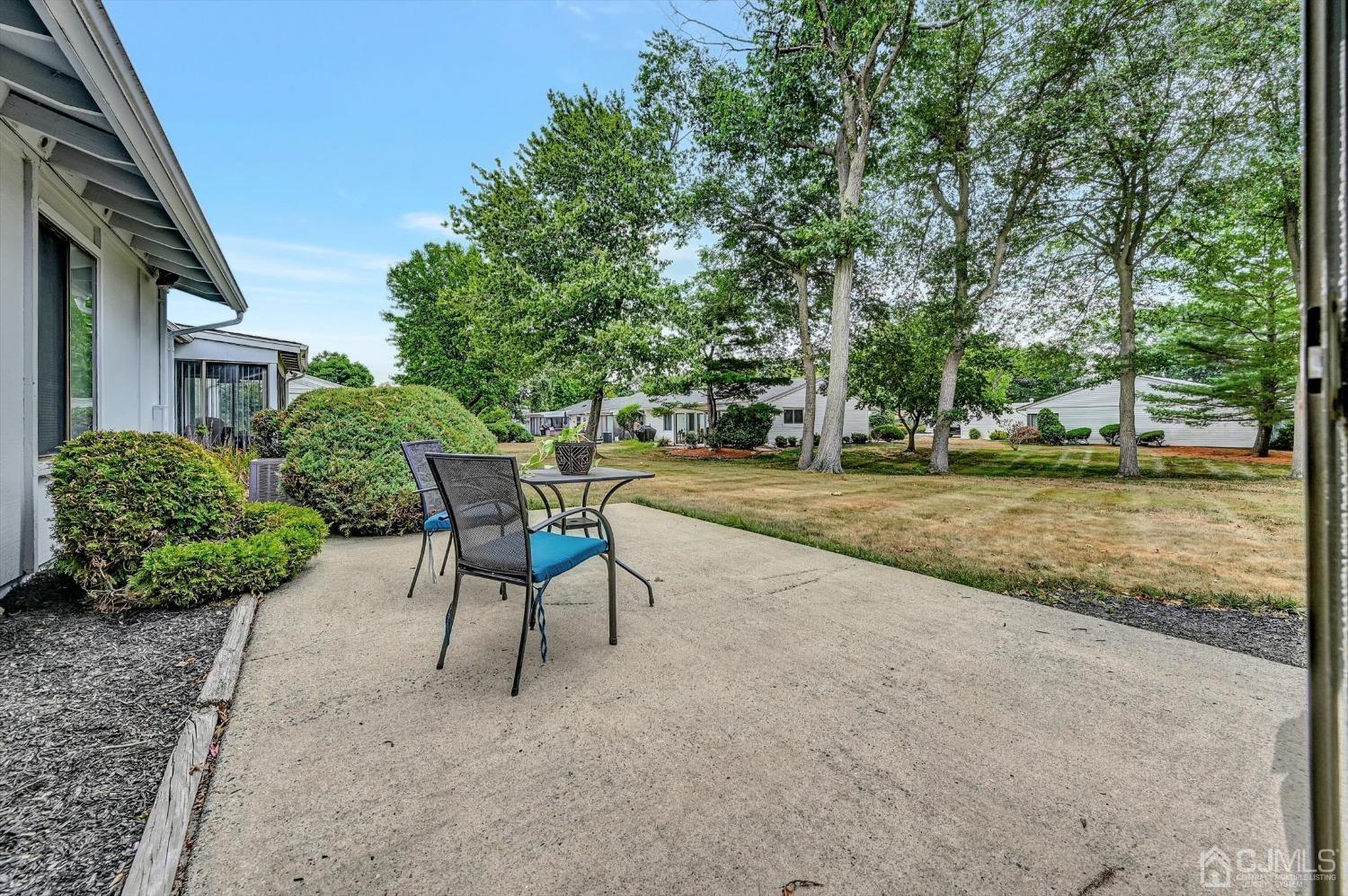 B Haddon Road Monroe Township, NJ 08831 - Photo 20 of 34 a view of a backyard with table and chairs and a barbeque