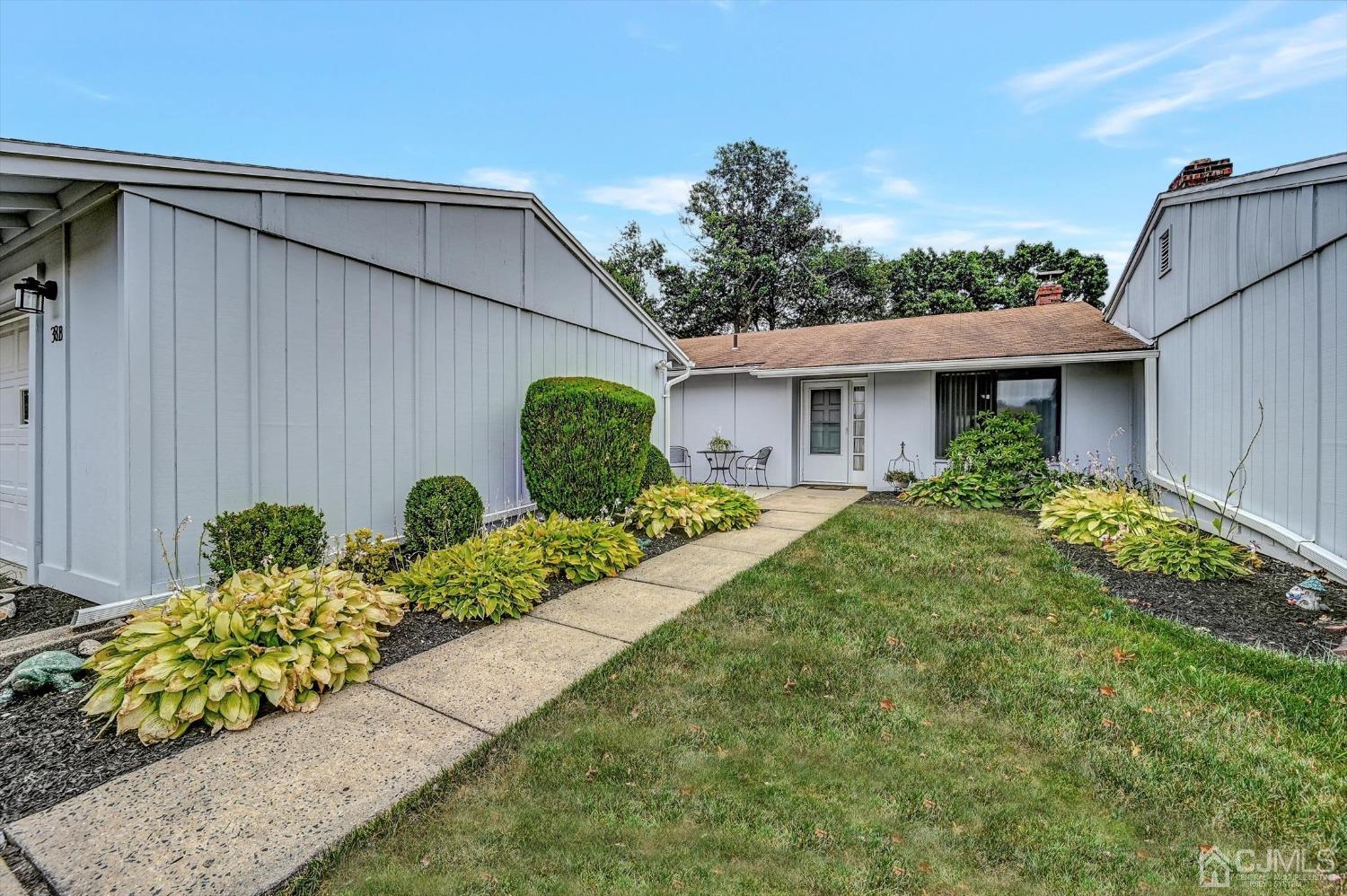 B Haddon Road Monroe Township, NJ 08831 - Photo 2 of 34 a front view of a house with garden