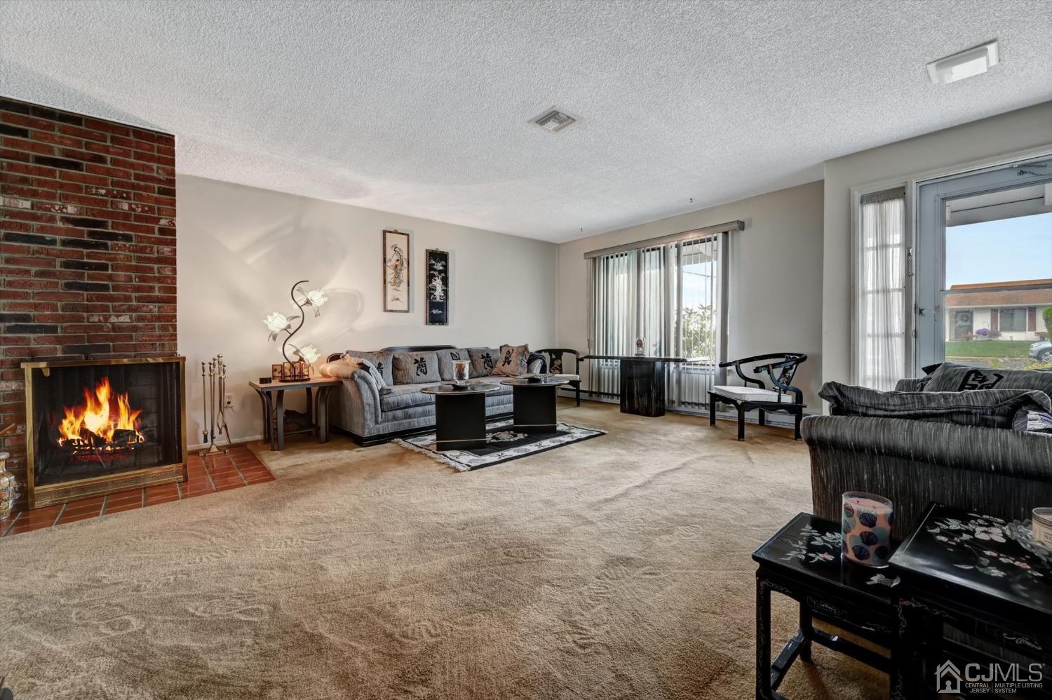 B Haddon Road Monroe Township, NJ 08831 - Photo 5 of 34 a living room with furniture and a fireplace
