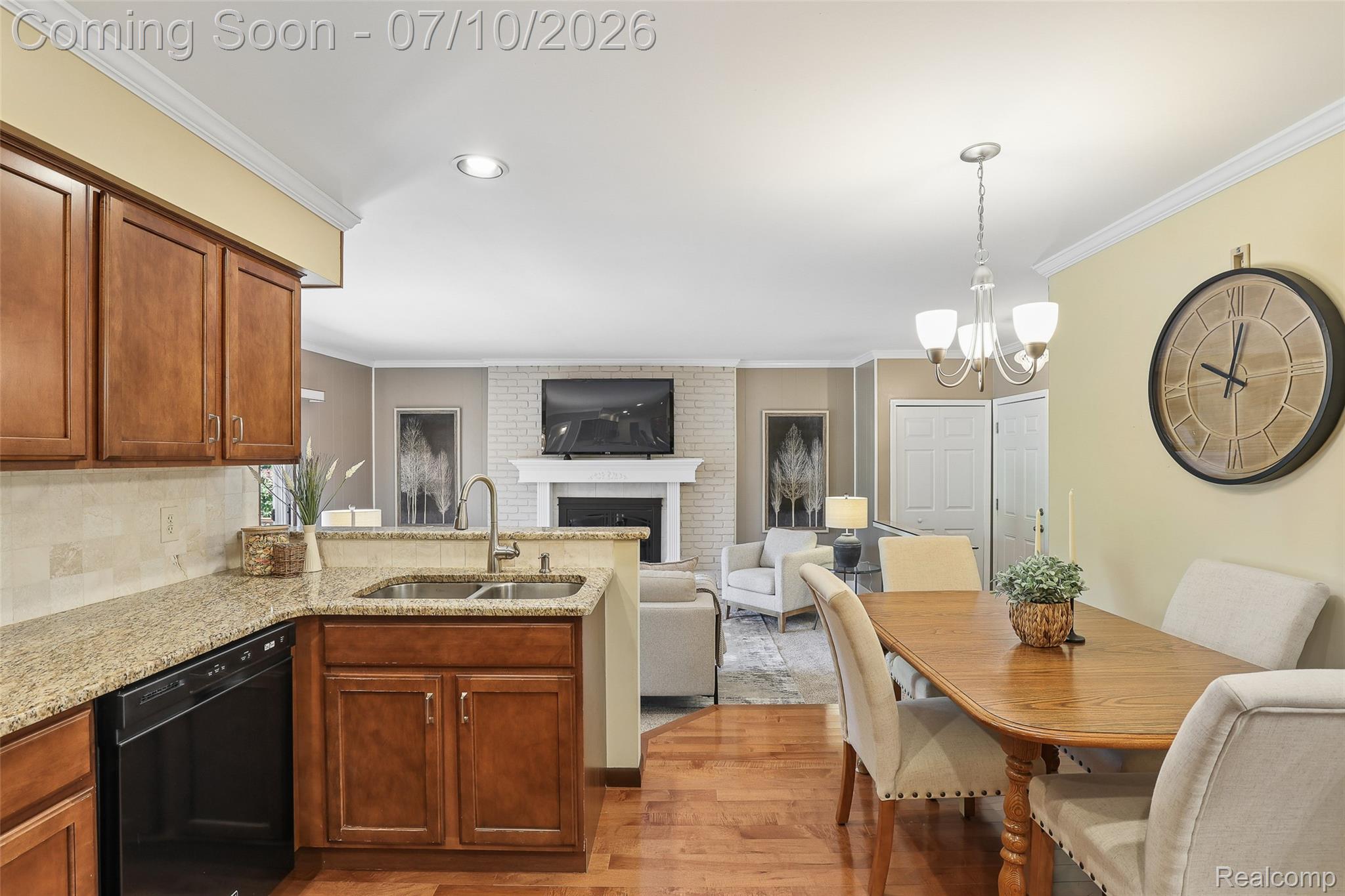 42698 Keystone Canton, MI 48187 - Photo 23 of 33 Kitchen featuring wood-finish cabinetry, granite countertops, and a stainless steel sink