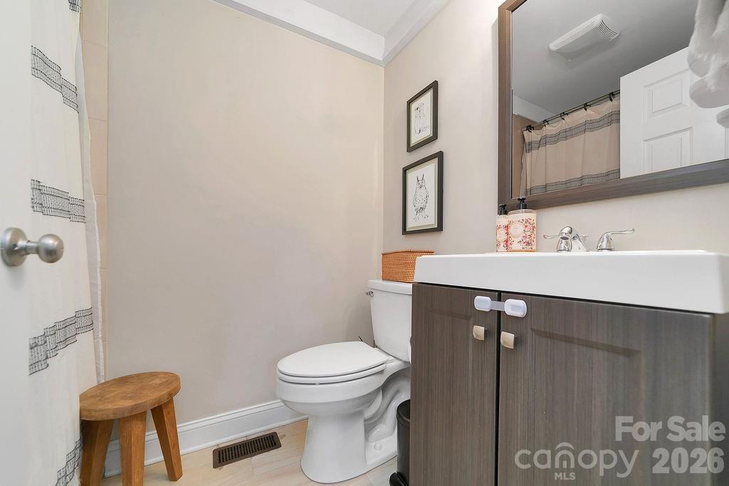 50 Illahee Point Brevard, NC 28712 - Photo 14 of 37 a bathroom with a sink mirror vanity and toilet
