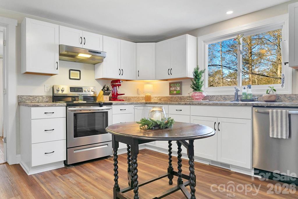 50 Illahee Point Brevard, NC 28712 - Photo 17 of 37 a kitchen with stainless steel appliances a stove a sink and cabinets