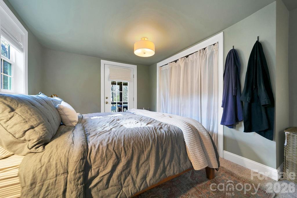 50 Illahee Point Brevard, NC 28712 - Photo 19 of 37 a bed sitting in a bedroom next to a window