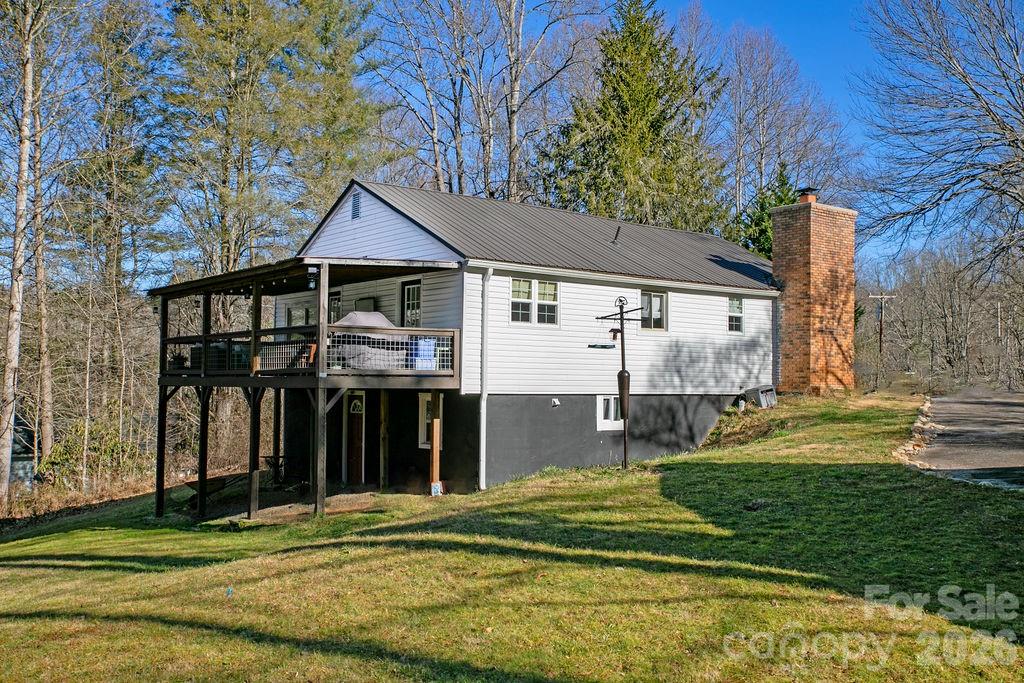 50 Illahee Point Brevard, NC 28712 - Photo 4 of 37 a front view of a house with a yard table and chairs