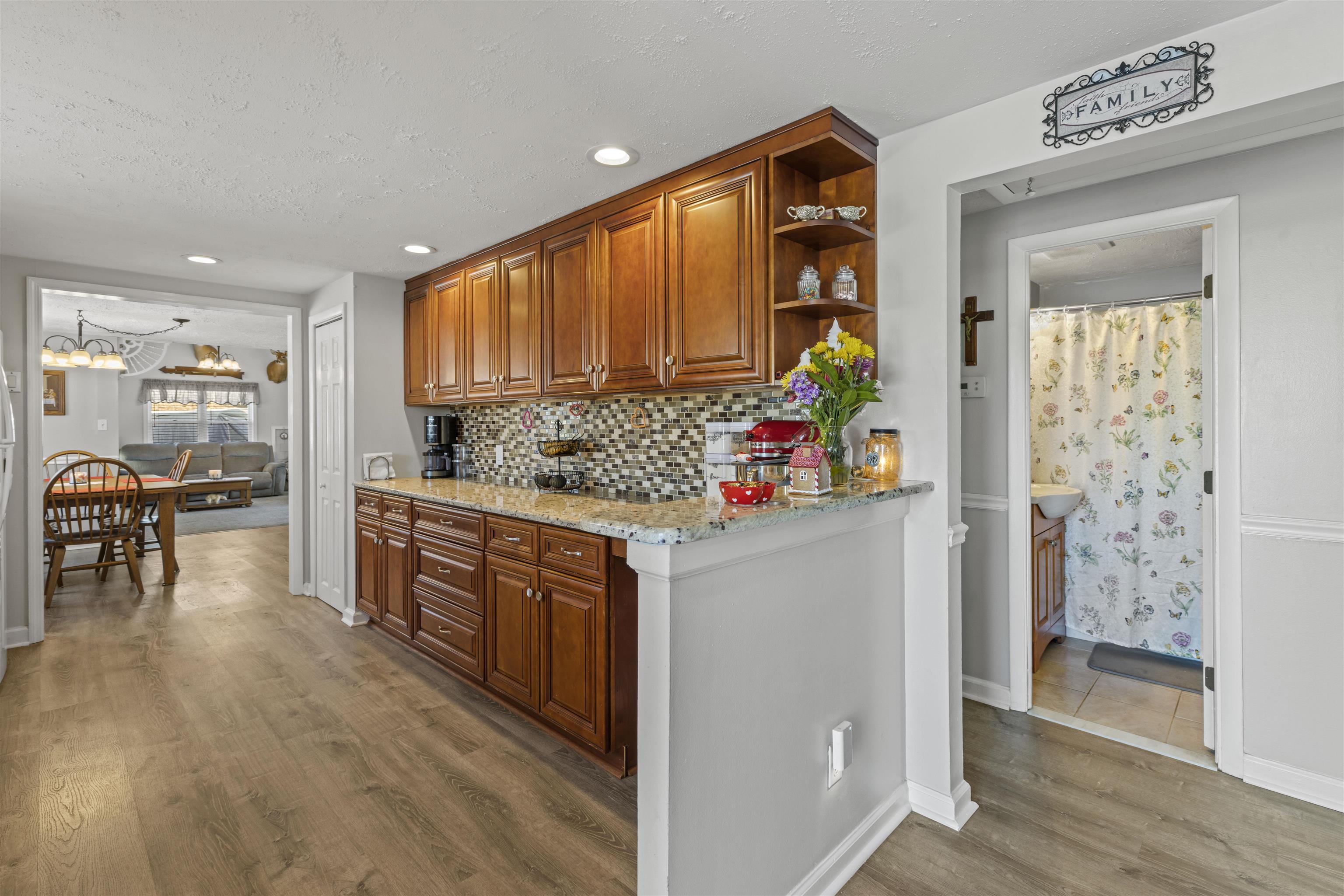 112 East Drumbed Road Villas, NJ 08251 - Photo 15 of 42 a kitchen with stainless steel appliances granite countertop a stove a refrigerator and a wooden cabinets