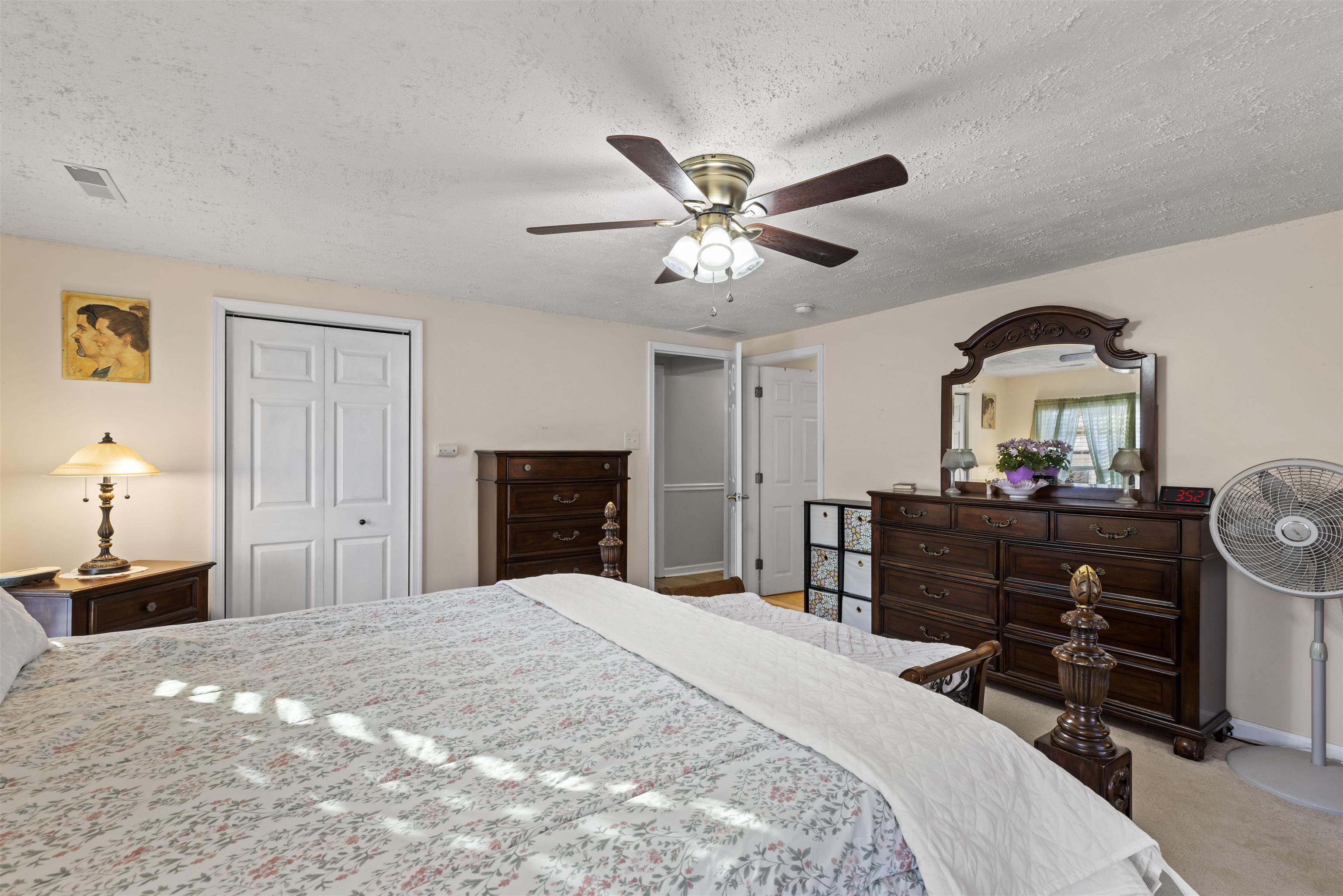 112 East Drumbed Road Villas, NJ 08251 - Photo 23 of 42 a bedroom with a bed and a chandelier