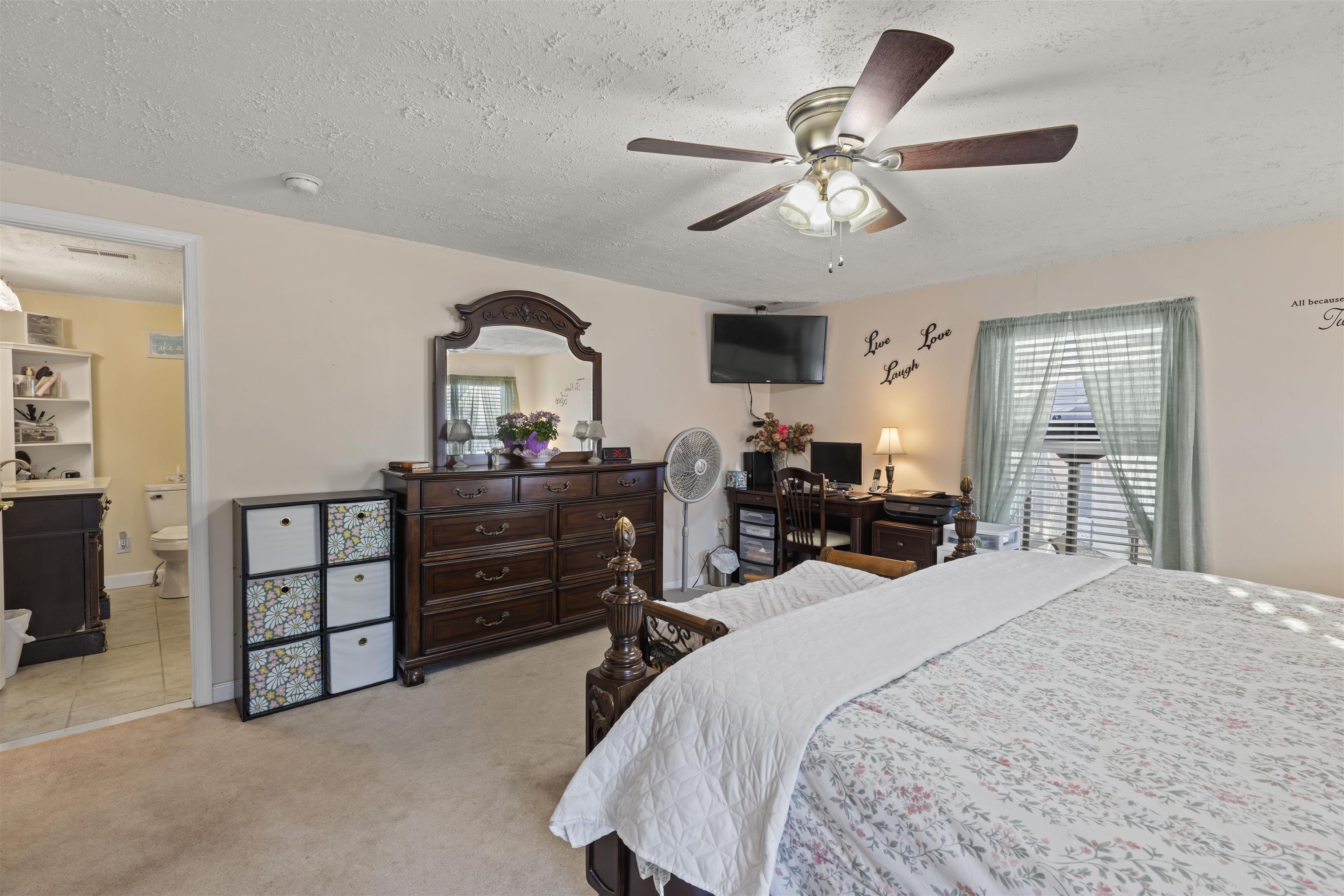 112 East Drumbed Road Villas, NJ 08251 - Photo 24 of 42 a bedroom with a bed and a chandelier