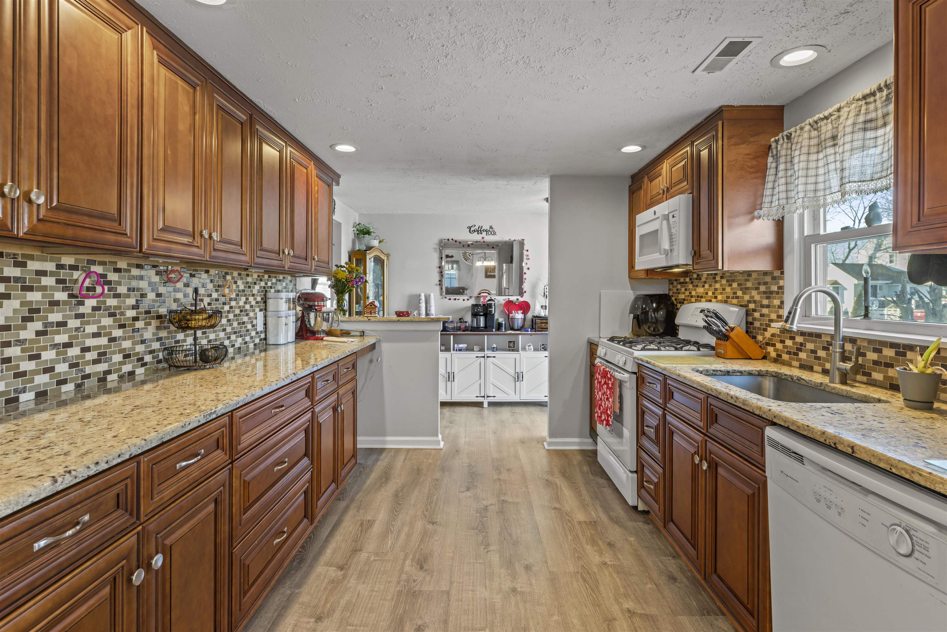 112 East Drumbed Road Villas, NJ 08251 - Photo 5 of 42 a kitchen with stainless steel appliances granite countertop lots of counter top space and wooden floor