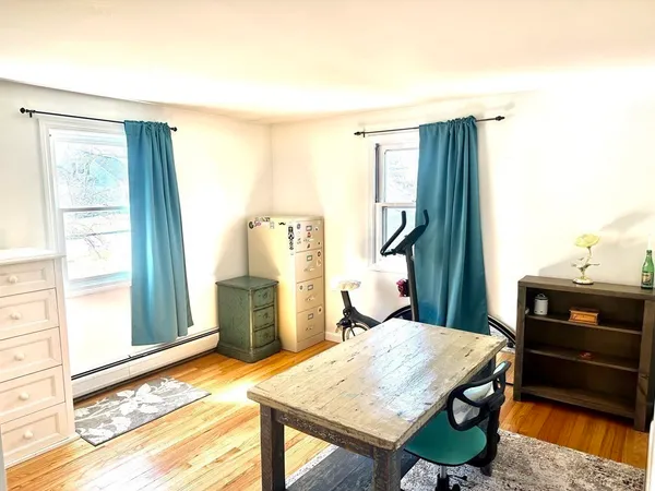 a view of a room that has a table and a chair