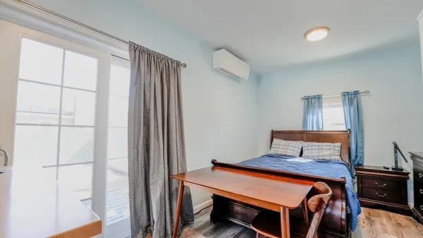 a view of kitchen with furniture and wooden floor