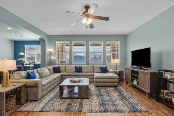 a living room with furniture and a flat screen tv