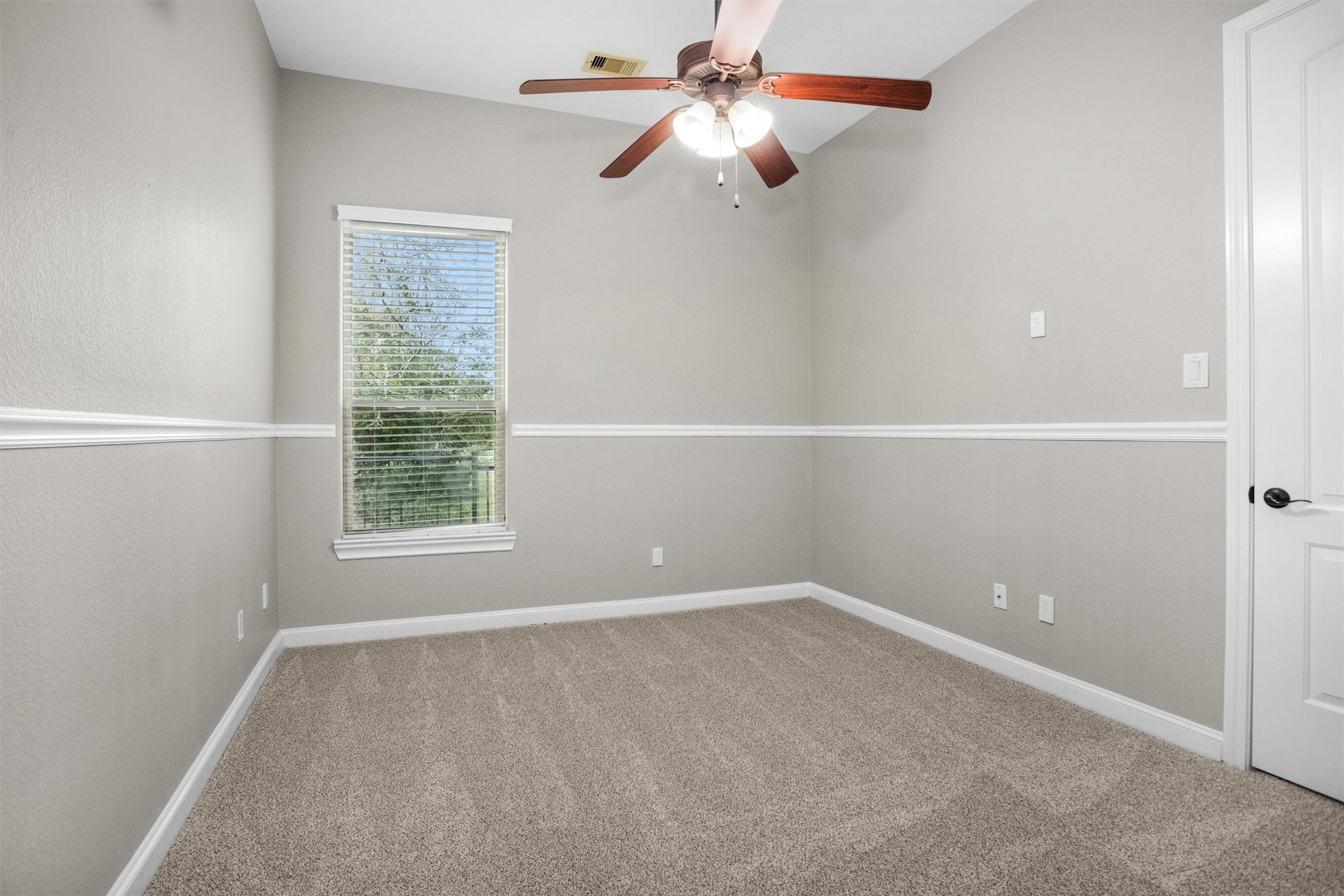 27910 Hansons Court Spring, TX 77386 - Photo 23 of 50 Third bedroom with fresh paint, new carpet and pad, decorative chairail trim and a walk-in closet