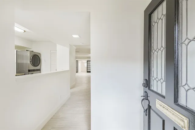 a view of a kitchen with a sink and cabinets