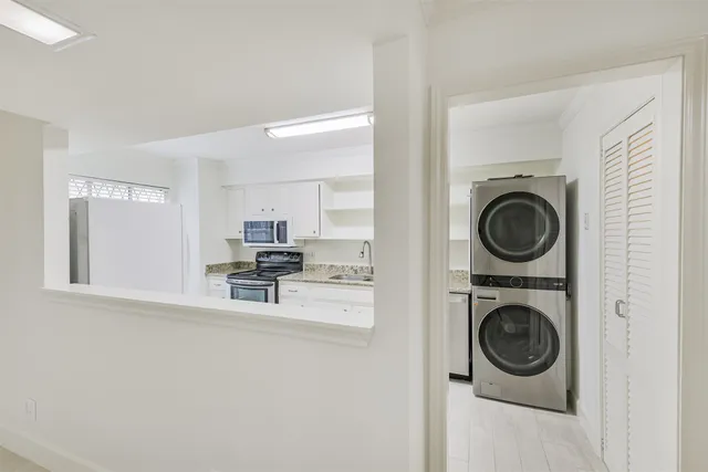 a view of livingroom with washer and dryer