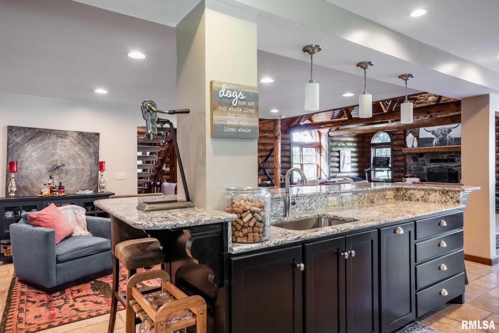 2145 Lick Creek Road Anna, IL 62906 - Photo 14 of 64 a kitchen with granite countertop a sink and a refrigerator