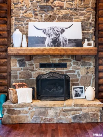 a bedroom with furniture and a large window
