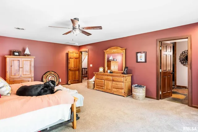 a view of living room with furniture and a fireplace