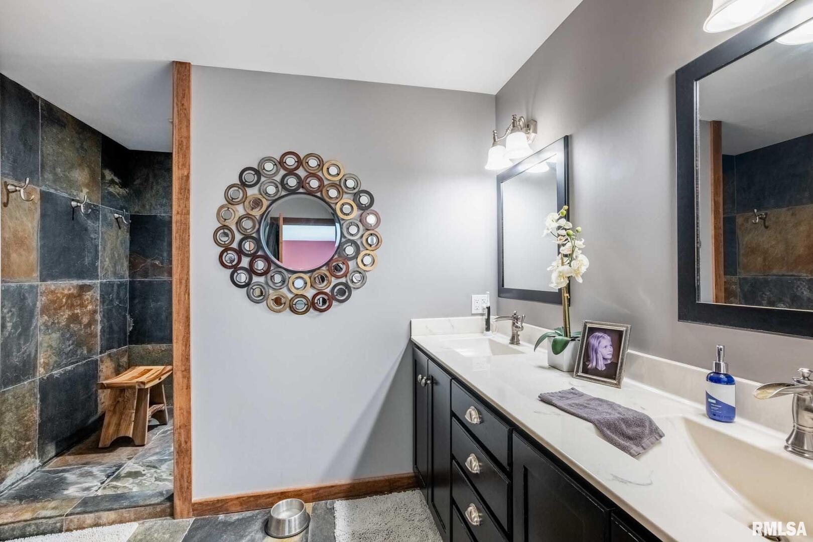 2145 Lick Creek Road Anna, IL 62906 - Photo 18 of 64 a bathroom with a sink double vanity and a mirror