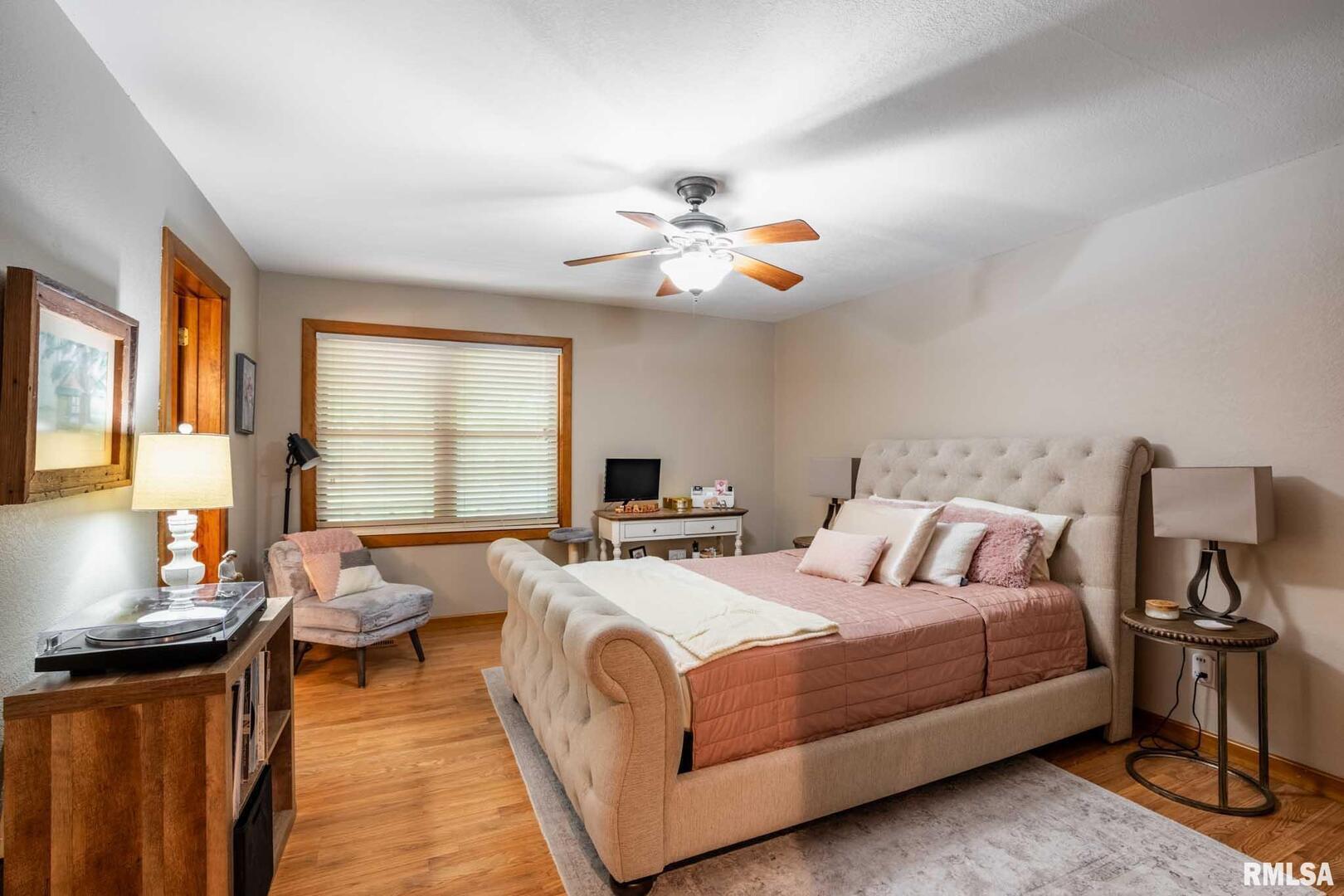 2145 Lick Creek Road Anna, IL 62906 - Photo 30 of 64 a bedroom with a bed and wooden floor