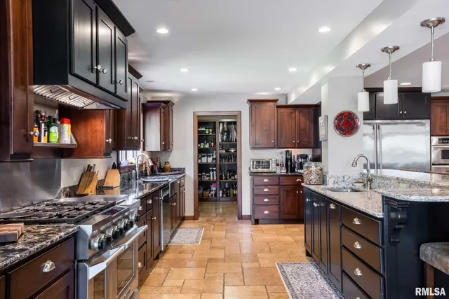 a kitchen with a refrigerator and a sink