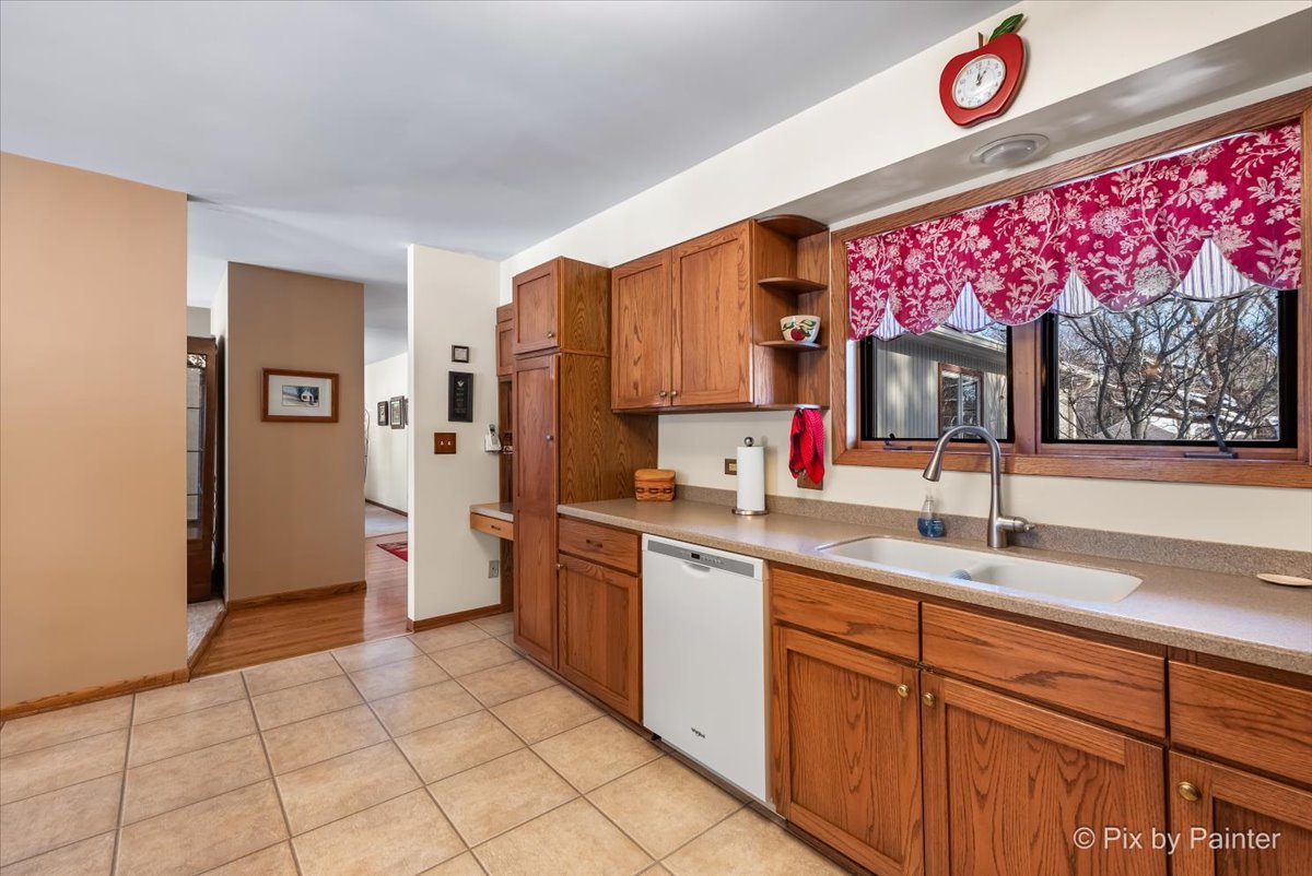4507 Hanover Drive Crystal Lake, IL 60012 - Photo 15 of 63 a kitchen with granite countertop a sink stainless steel appliances and cabinets