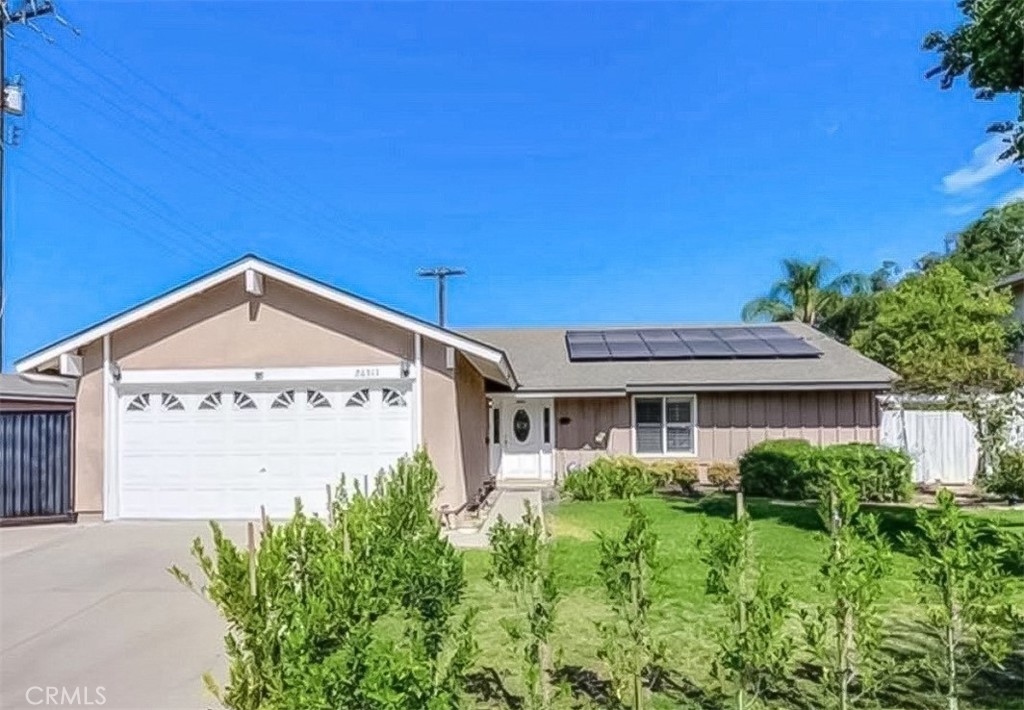 20311 Flintgate Drive Walnut, CA 91789 - Photo 1 of 32 a front view of a house with a garden
