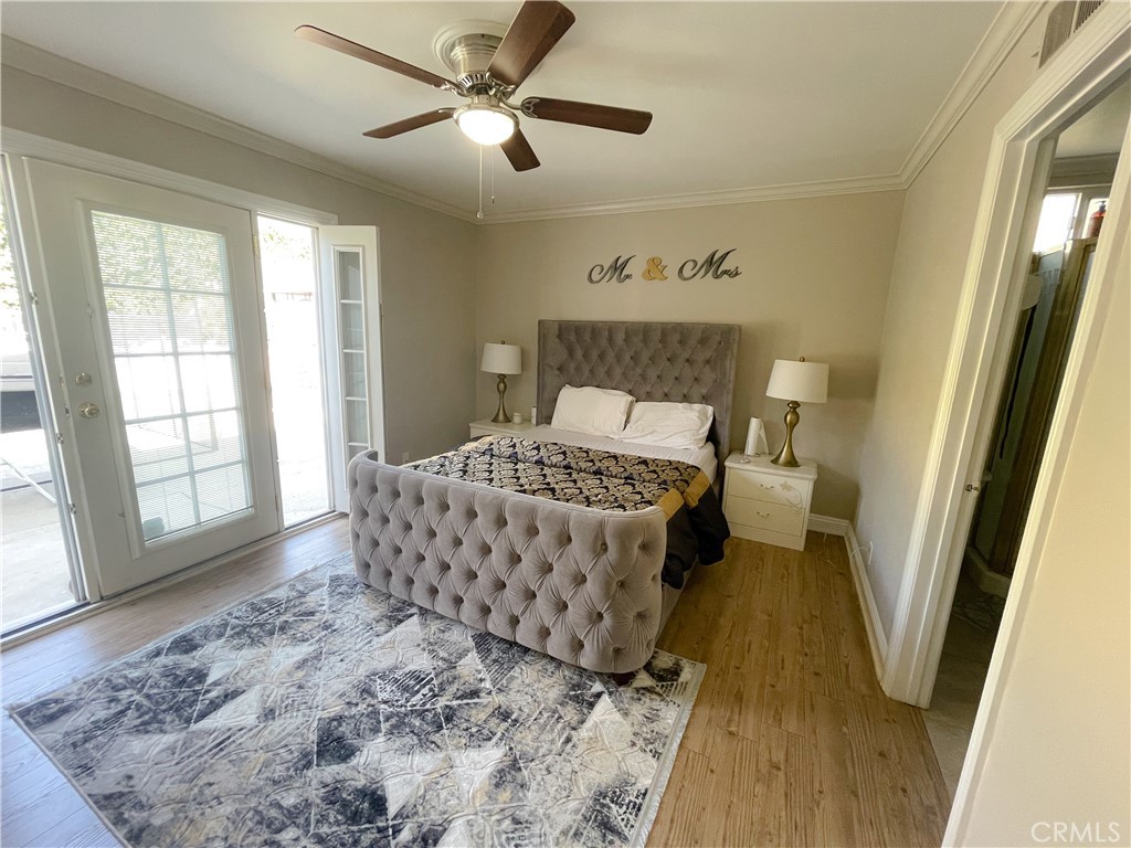 20311 Flintgate Drive Walnut, CA 91789 - Photo 23 of 32 a bedroom with a bed and wooden floor