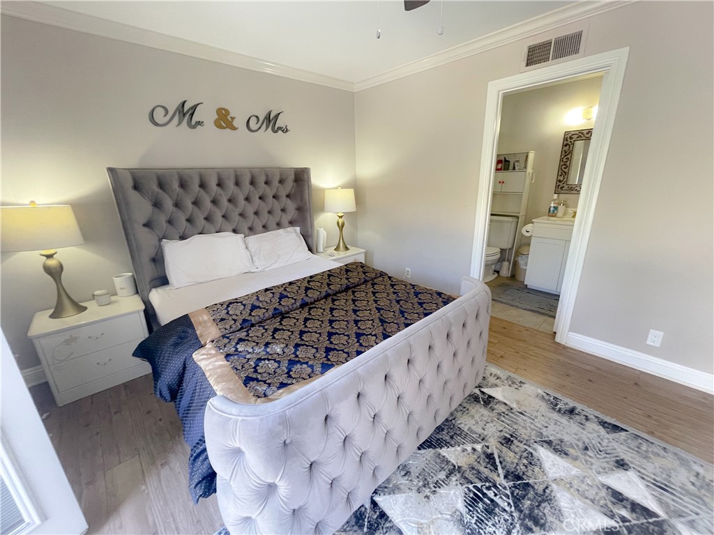 20311 Flintgate Drive Walnut, CA 91789 - Photo 24 of 32 a bedroom with a large bed and a couch