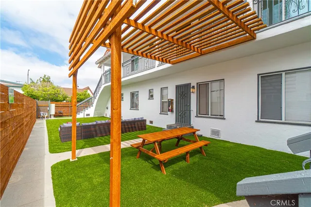 a living room with furniture rug and a window