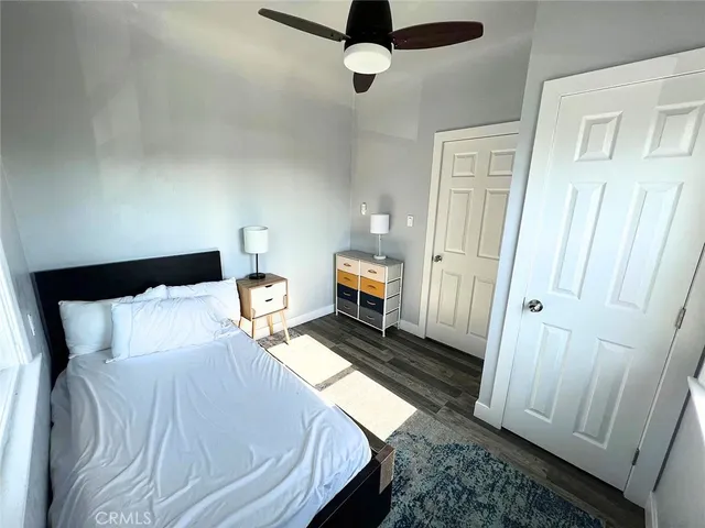 a kitchen with stainless steel appliances white cabinets and a stove top oven