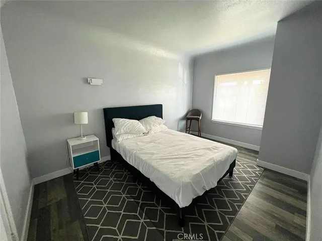 a view of a brick house with a large window