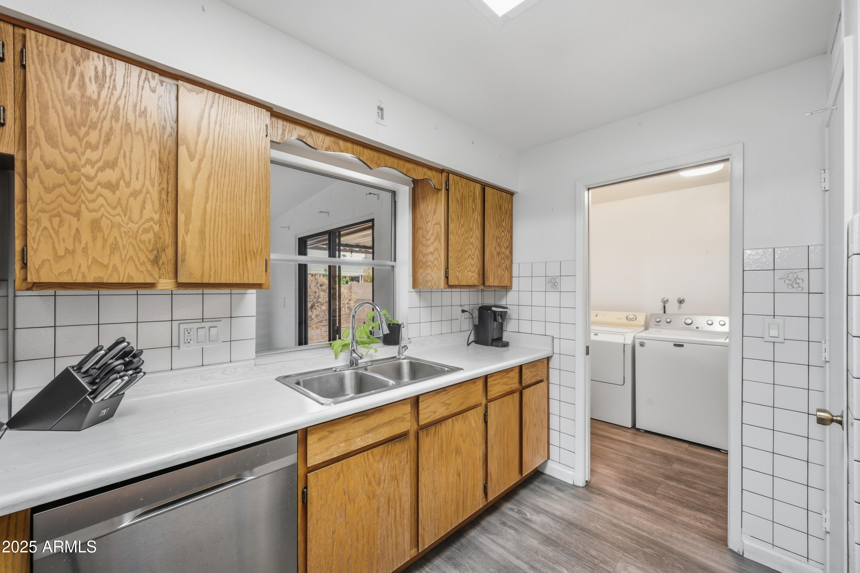 443 South Reseda Mesa, AZ 85206 - Photo 11 of 26 a kitchen with sink cabinets and wooden floor