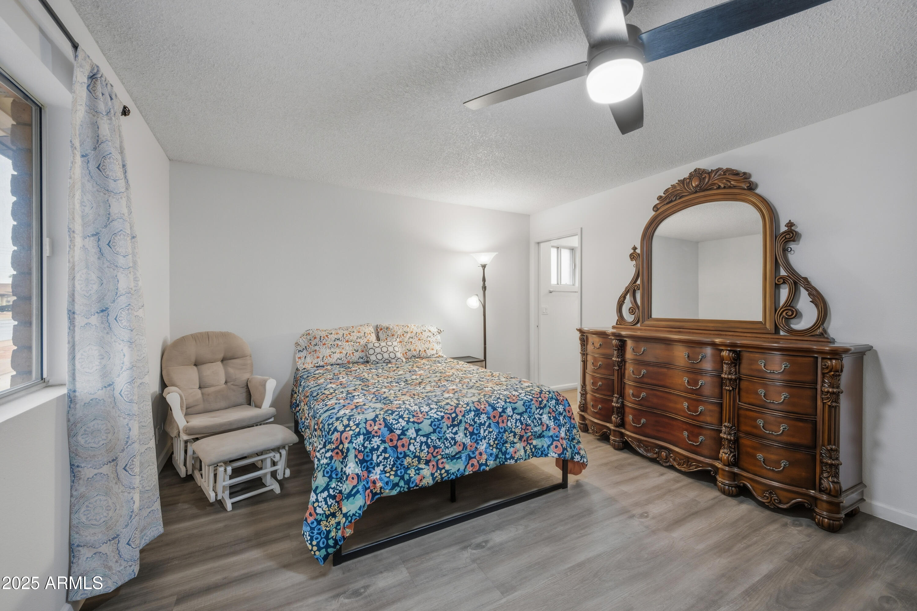 443 South Reseda Mesa, AZ 85206 - Photo 12 of 26 a bedroom with a bed and a dresser