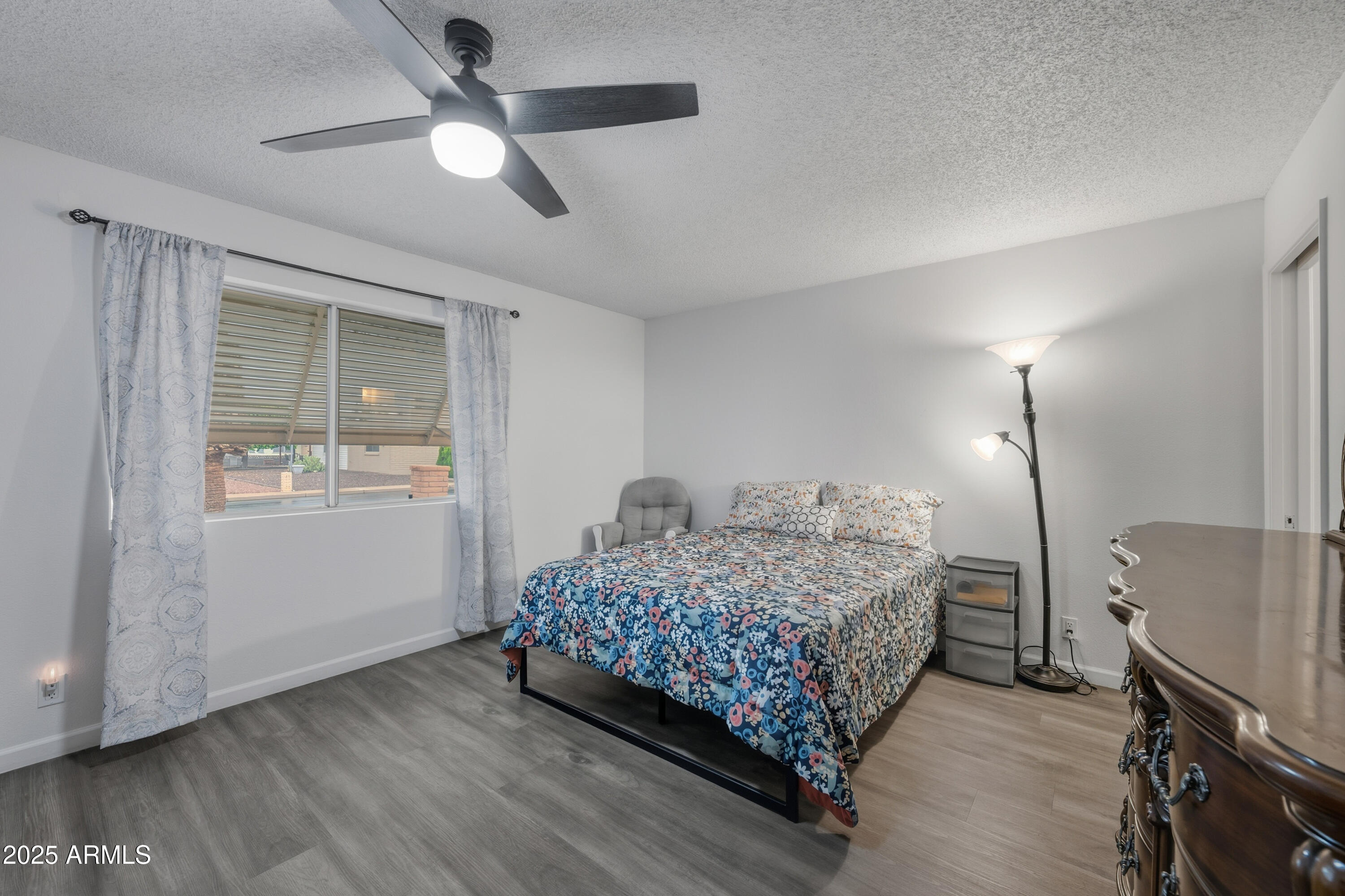 443 South Reseda Mesa, AZ 85206 - Photo 13 of 26 a bedroom with a bed and a ceiling fan
