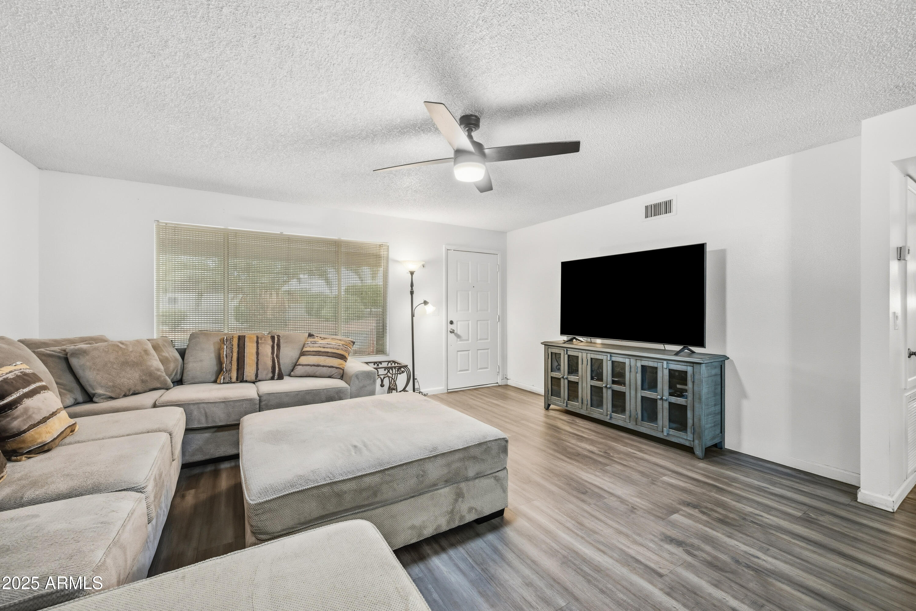 443 South Reseda Mesa, AZ 85206 - Photo 6 of 26 a living room with furniture and a flat screen tv