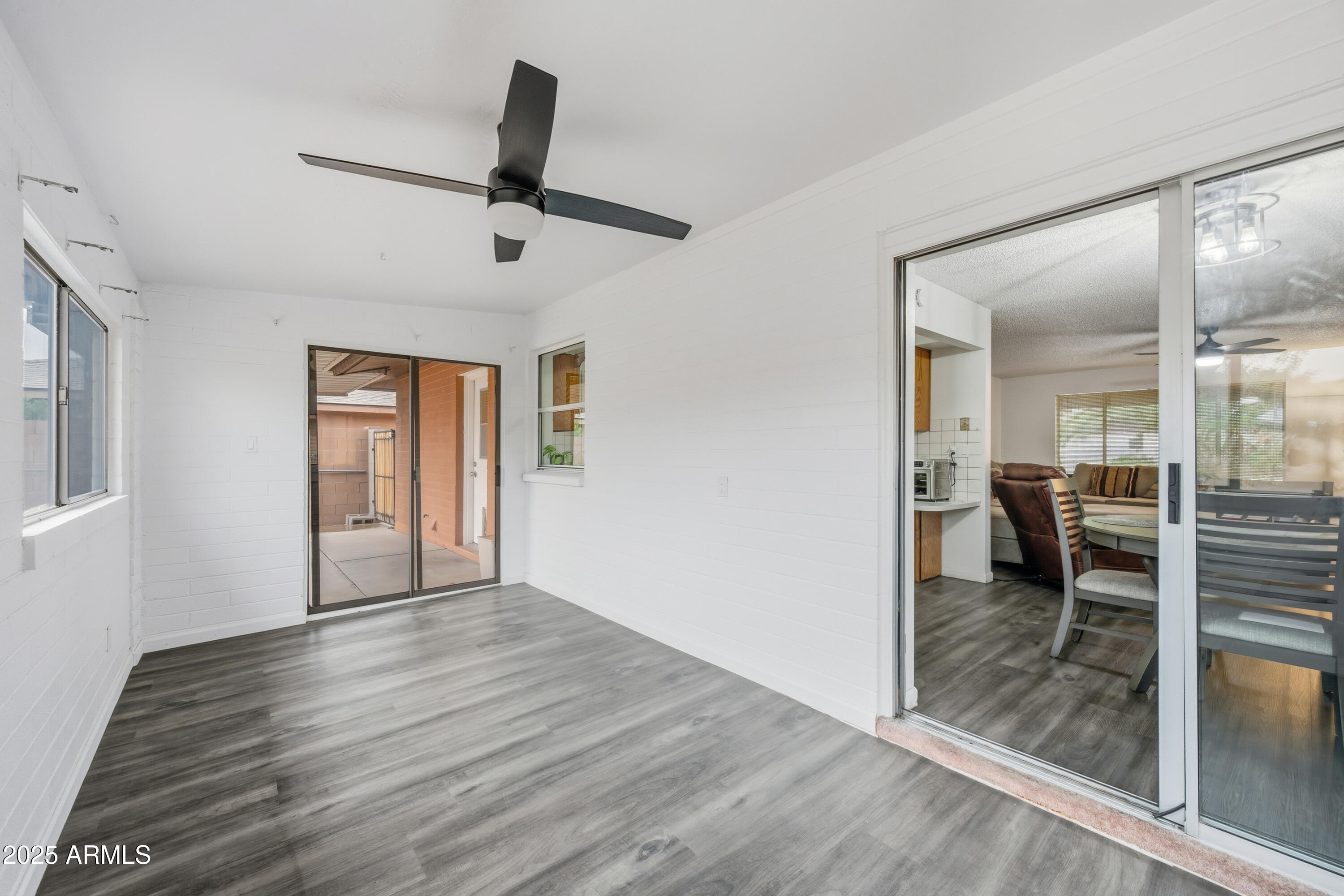 443 South Reseda Mesa, AZ 85206 - Photo 7 of 26 wooden floor in an empty room with a window