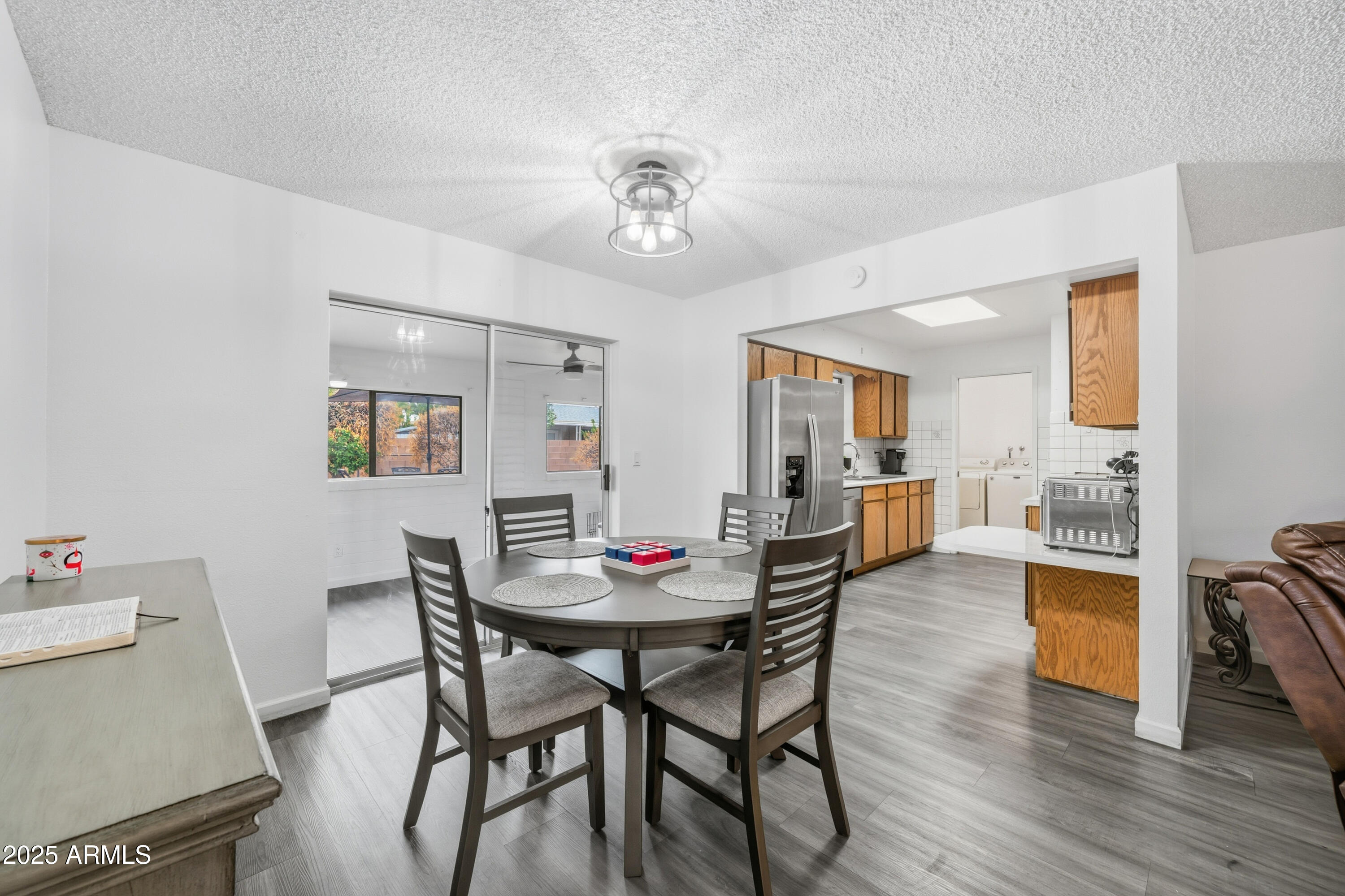 443 South Reseda Mesa, AZ 85206 - Photo 8 of 26 a view of a dining room with furniture and wooden floor