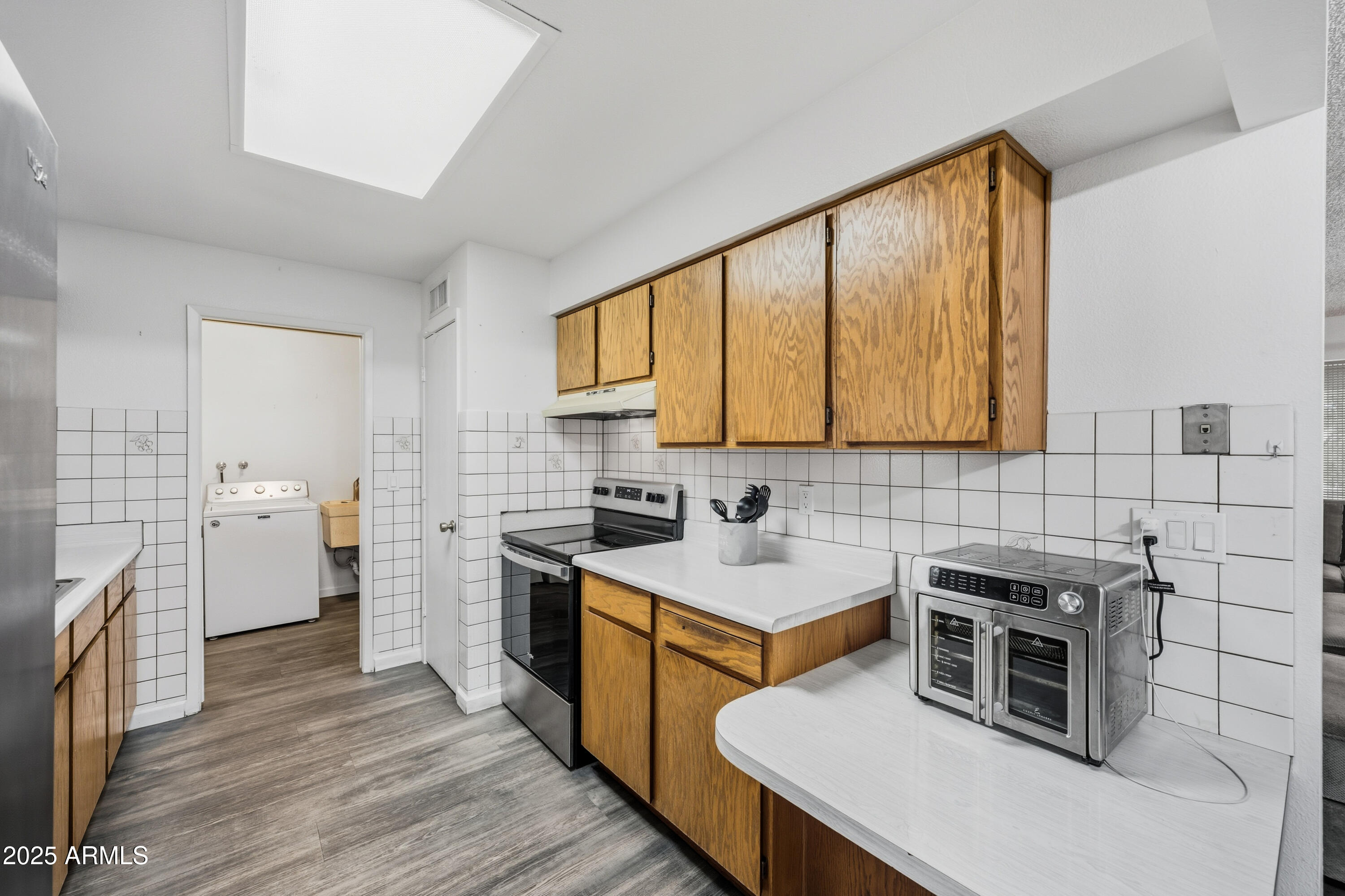 443 South Reseda Mesa, AZ 85206 - Photo 9 of 26 a kitchen that has a sink and a stove top oven